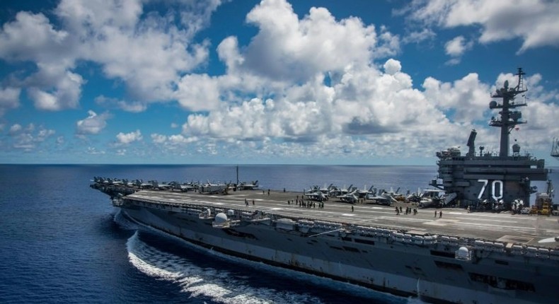 USS Carl Vinson, seen here in a US Navy handout in the Phillipine Sea, is heading toward North Korea after initial confusion over its route