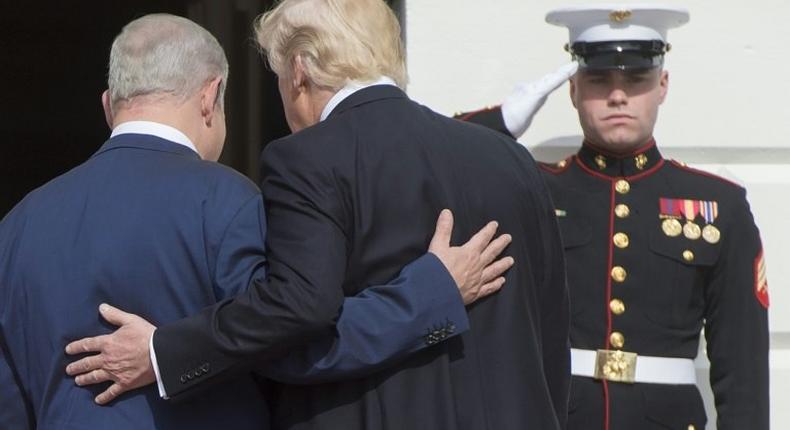 US President Donald Trump and Israeli Prime Minister Benjamin Netanyahu walk into the White House on February 15 2017