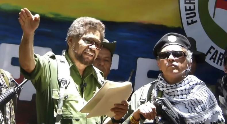 Former senior commander of the dissolved FARC rebel group Ivan Marquez (L) and fugitive rebel Jesus Santrich (R) are pictured in a video published on August 29, 2019 announcing their return to arms