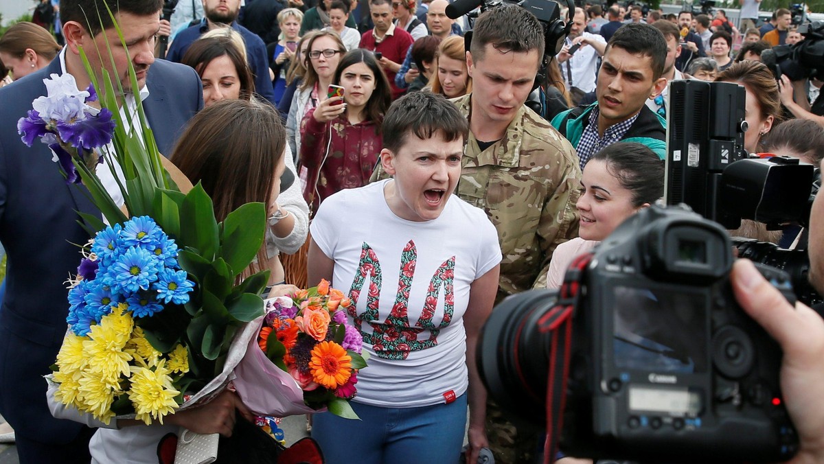 Ukrainian servicewoman Nadiya Savchenko and her sister Vera Savchenko walk at Boryspil International