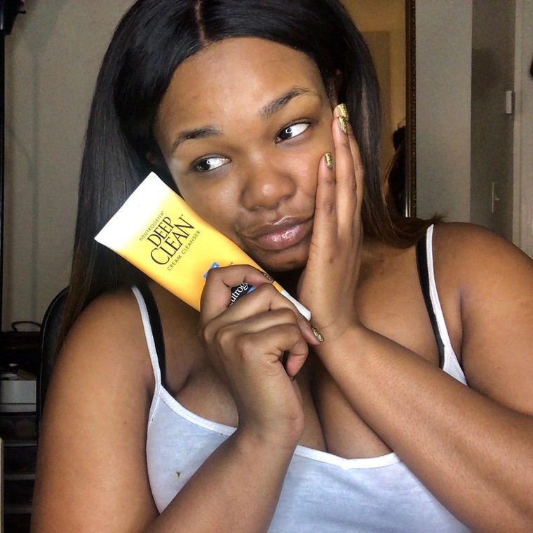 Woman holding cleanser(hercampus) 
