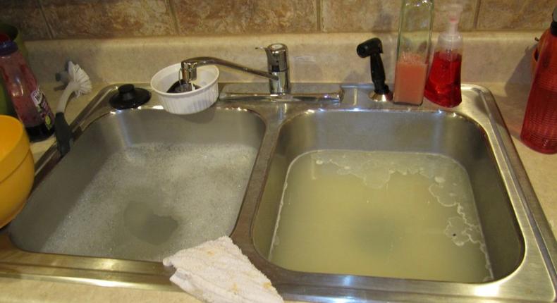 How to unclog your kitchen sink (John The Plumber)