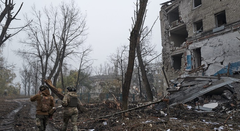 Two Ukrainian soldiers walk in Avdiivka, Ukraine. Fighting has intensified in recent days after Russia launched a major offensive there last month.Vlada Liberova / Libkos via Getty Images