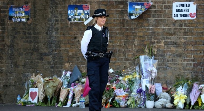 Residents of the multi-ethnic neighbourhood of Finsbury Park left flowers near the scene of the attack against worshippers near the local mosque on June 19, 2017