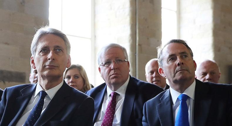 Chancellor Philip Hammond (L), Conservative Party Chairman Patrick McLoughlin (M), and International Trade Secretary Liam Fox (R).