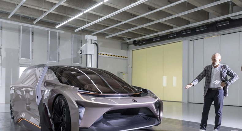 A person views one of Nio's self-driving electric cars in Germany.