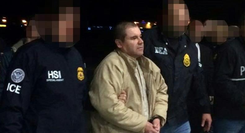 Mexican drug baron Joaquin El Chapo Guzman being escorted in Ciudad Juarez by Mexican police as he is extradited to the United States