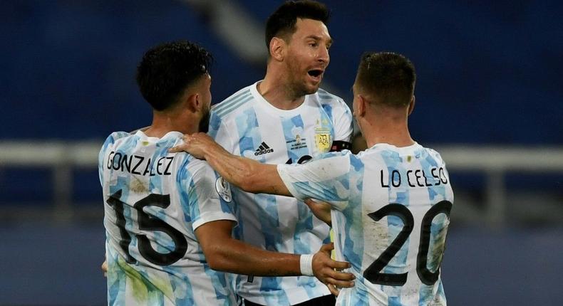 Argentina's Lionel Messi (center) celebrates his goal against Chile at the 2021 Copa America with teammates Nicolas Gonzalez (left) and Giovani Lo Celso Creator: MAURO PIMENTEL