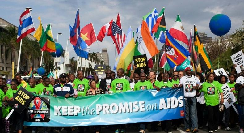 AIDS activists march through the streets of Durban on July 16, 2016