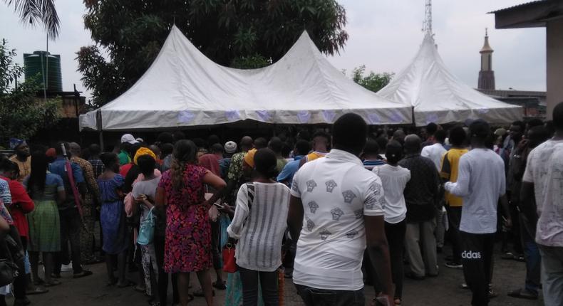 Nigerians queuing at the Independent National Electoral Commission (INEC) office [Illustration[