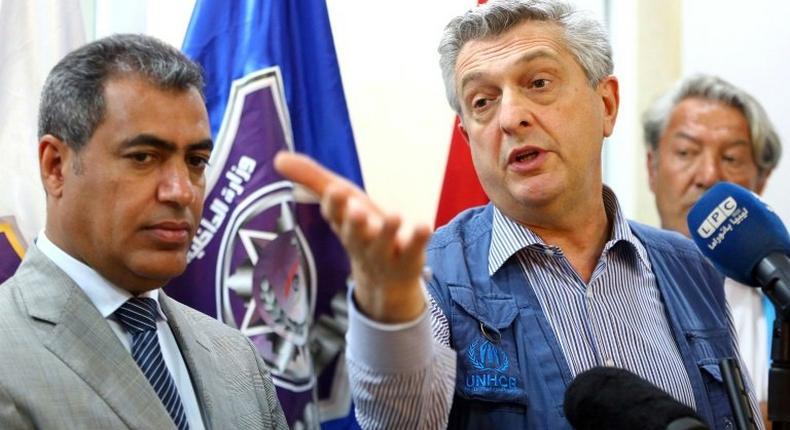 UNHCR chief Filippo Grandi during a press conference at the Tripoli branch of the Illegal Immigration Authority, next to its director Colonel Mohammed Beshr, on May 21, 2017