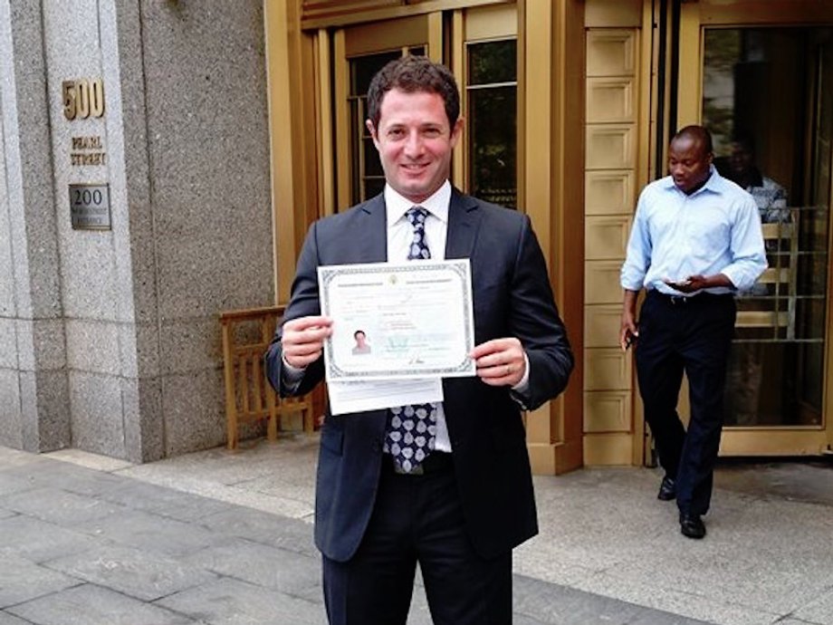 YouVisit cofounder Taher Baderkhan proudly displays his US citizenship on the day he became a citizen.