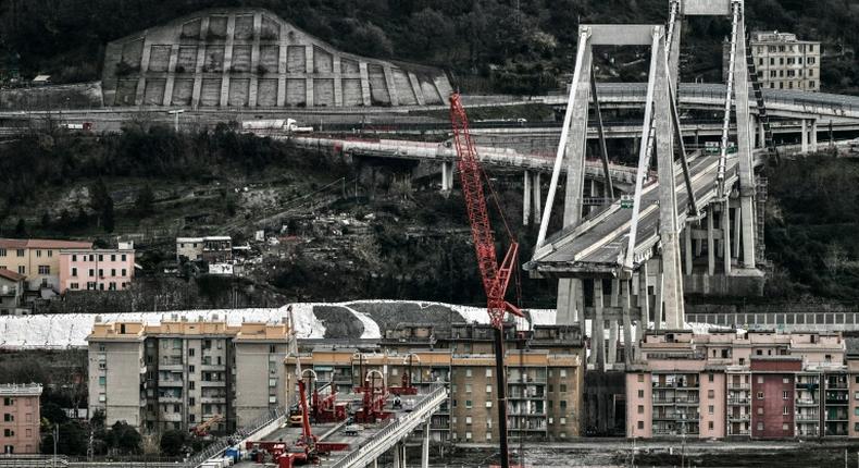 Thousands of tonnes of steel, concrete and asphalt have already been removed from the spectacularly truncated high-rise bridge to make it lighter before the 'deconstruction' begins