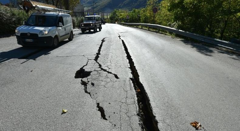 Cracks on the road outside the centre of Norcia, central Italy pictured a day after a 6.5-magnitude earthquake struck on October 30, 2016