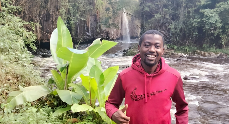 William Maina in a waterfall exploration