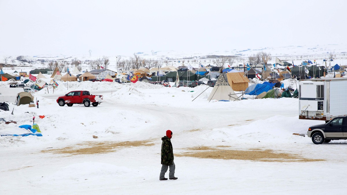 A man walks through the Dakota Access Pipeline protest camp on the edge of the Standing Rock Sioux R