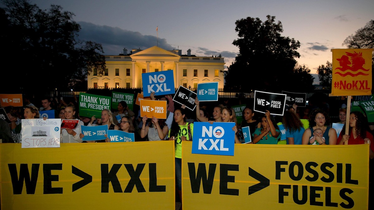 A small group of activists gather to celebrate the Obama administration's rejection of the Keystone 