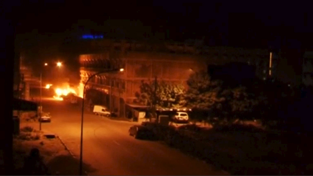 A general view shows fire beneath Splendid Hotel in Ouagadougou