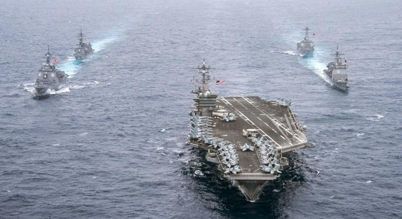 Aircraft carrier USS Carl Vinson leads the US Navy and the Japan Maritime cruisers and destroyers, on April 26, 2017