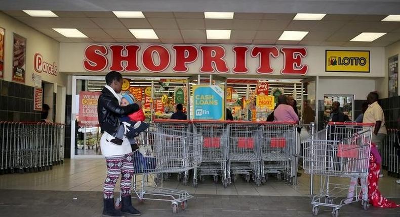 A shopper is seen outside a Shoprite store in Johannesburg July 7, 2015. REUTERS/Siphiwe Sibeko