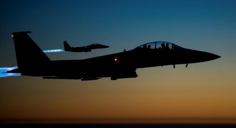 A pair of US F-15E aircraft fly over Iraq after conducting air strikes in Syria in 2014, shown in this US Air Force picture