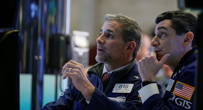 Traders work on the floor of the NYSE in New York
