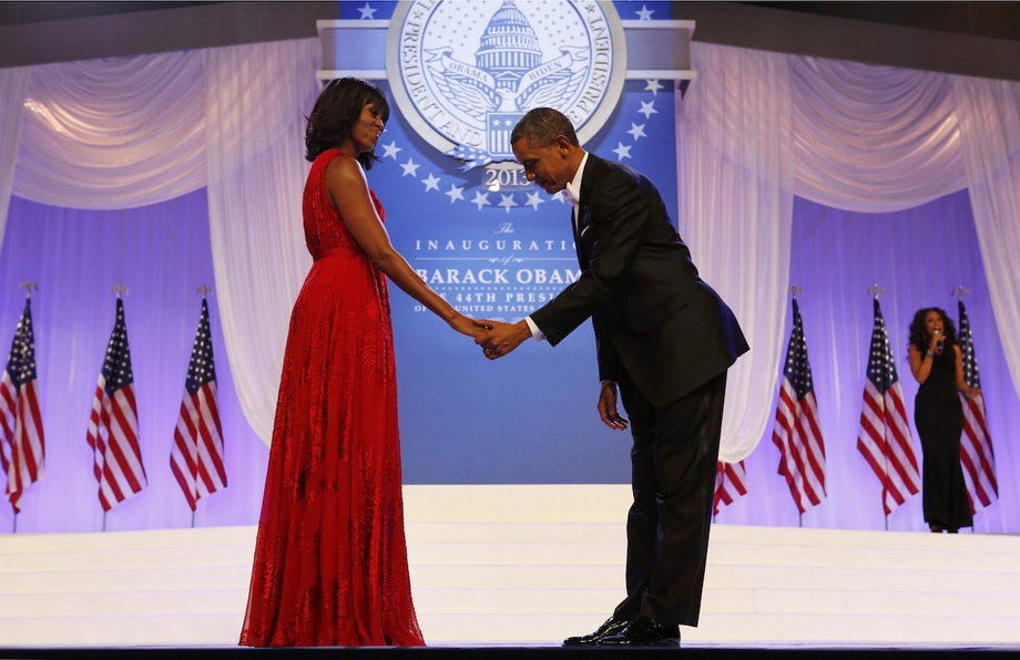 President Barack Obama bows to Michelle Obama at the Inauguration Ball in 2013.