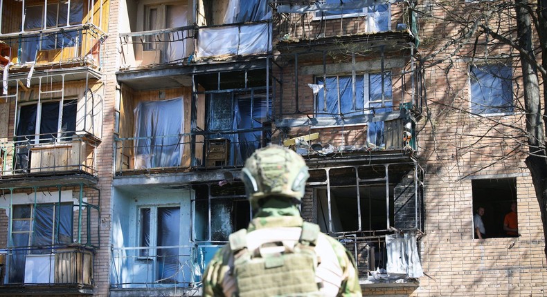 A local volunteer looks at a building damaged by Ukrainian strikes in Kursk on August 16, 2024, following Ukraine's offensive into Russia's western Kursk region.TATYANA MAKEYEVA/AFP via Getty Images