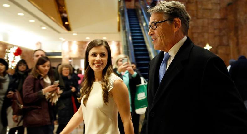 Former Texas Gov. Rick Perry, right, enters Trump Tower with Trump aide Madeleine Westerhout, before meeting with President-elect Donald Trump, Monday, Dec. 12, 2016.