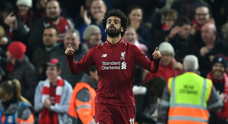 Mohamed Salah celebrates the goal that sent Liverpool into the Champions League last 16