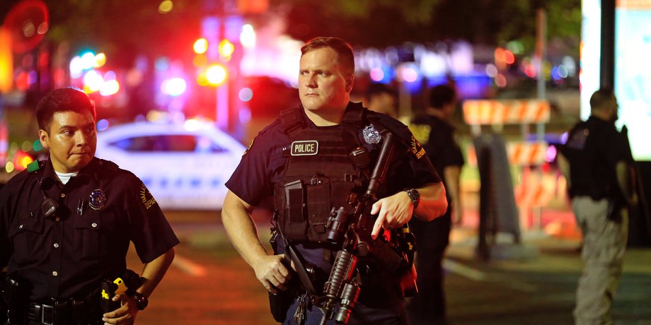 Dallas police stand watch near the scene where four Dallas police officers were shot and killed on July 7, 2016 in Dallas, Texas.