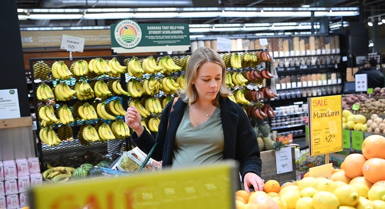 Kelly Hayes looks at produce that is on sale as she shops at Whole Foods Market in the Tenleytown neighborhood on Thursday April 28, 2022 in Washington, DC.