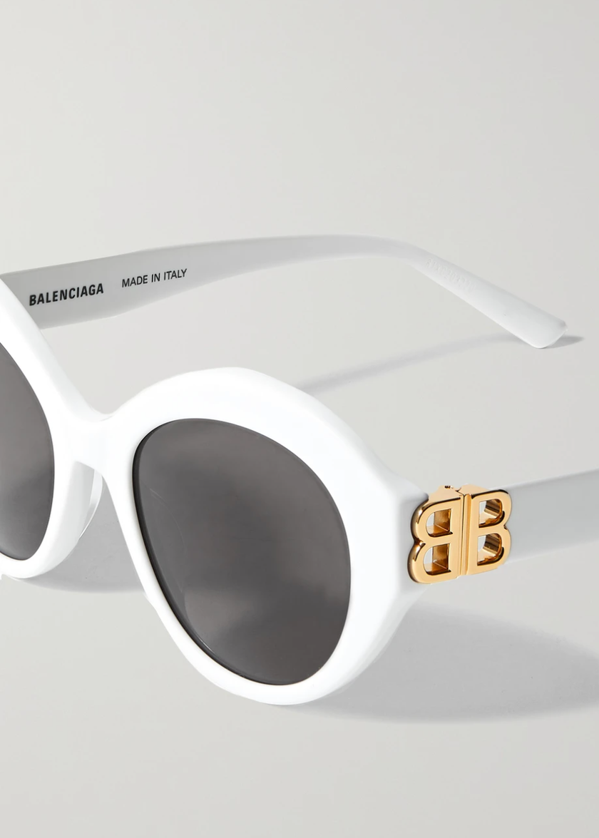 Lunettes de soleil à cadre rond de Balenciaga, environ 320 francs, chez Net-a-porter. 