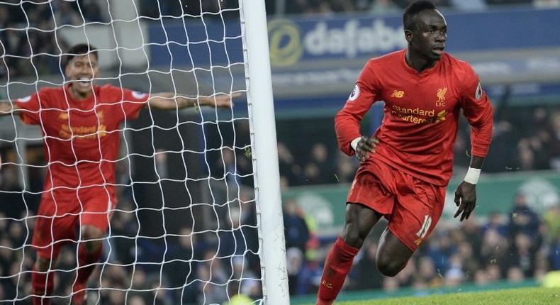 Liverpool's Senegalese midfielder Sadio Mane (R) says the squad is strong enough to make up for him playing at African football's showpiece tournament in Gabon