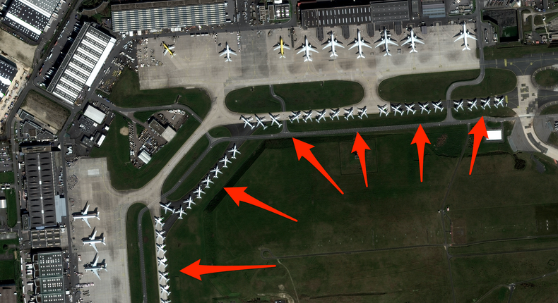 At Charles de Gaulle Airport in Paris, planes are parked along many taxiways.