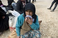 Syrians wait on Turkey-Syria border near Aleppo