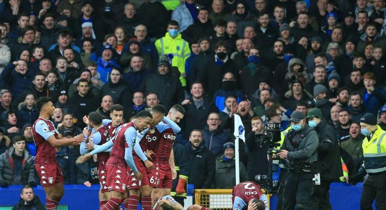 Aston Villa's Matty Cash and Lucas Digne react after being struck by bottles at Everton Creator: Lindsey Parnaby