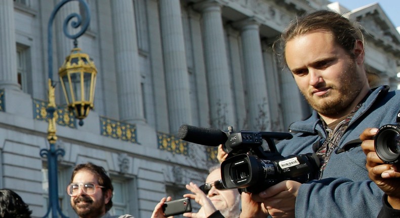 David DePape, right, outside City Hall in San Francisco, California, on December 19, 2013. Federal prosecutors charged DePape on Monday with assault and attempted kidnapping.Eric Risberg/AP