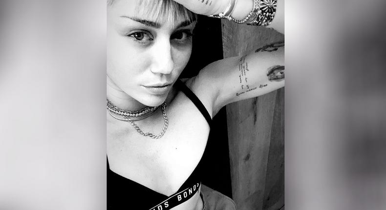 Miley Cyrus Shows Off Toned Abs While Doing Yoga