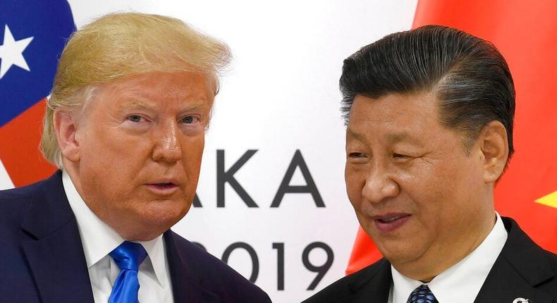 In this June 29, 2019, file photo, U.S. President Donald Trump poses for a photo with Chinese President Xi Jinping during a meeting on the sidelines of the G-20 summit in Osaka, western Japan.