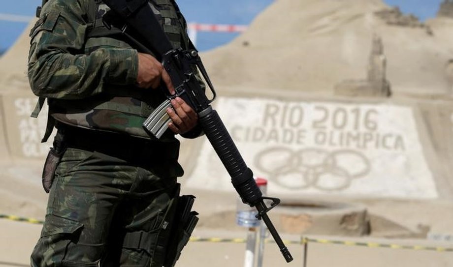 A Brazilian Army Forces soldier patrols on Copacabana beach ahead of the 2016 Rio Olympic games in Rio de Janeiro