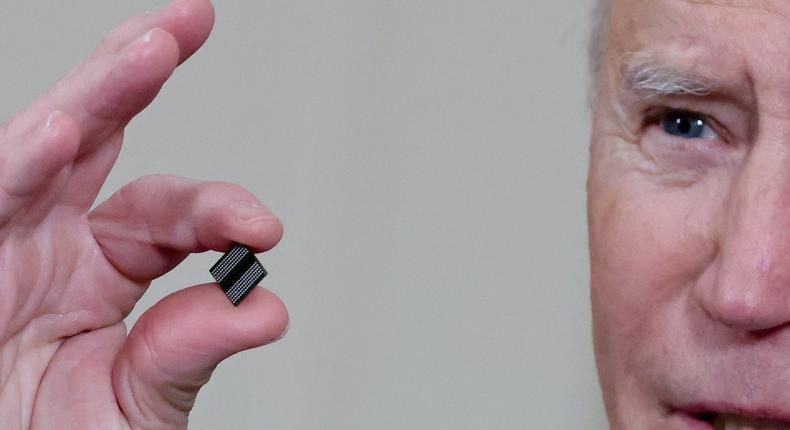 President Joe Biden holds a semiconductor chip at the White House in Washington, U.S., February 24, 2021.
