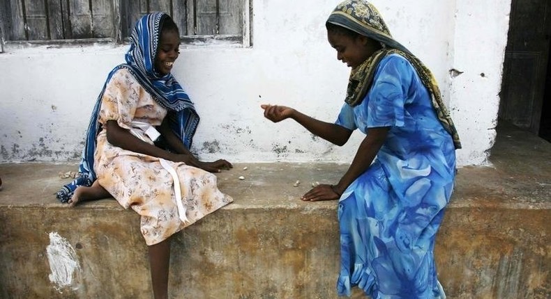 Girls play a game involving the picking up small stones in the village of Bwejuu on Zanzibar island, Tanzania, in a file photo. Picture taken December 2, 2007. REUTERS/Finbarr O'Reilly