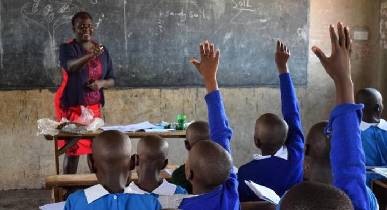 A teacher at Shauri Yako Primary school in Homa Bay town teaches grade four pupils