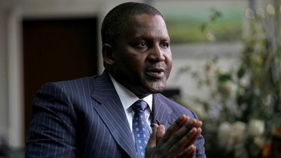 Founder and Chief Executive of the Dangote Group Aliko Dangote gestures during an interview with Reuters in his office in Lagos, Nigeria, June 13, 2012.     [REUTERS/Akintunde Akinleye]