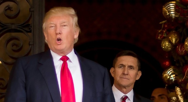 Former national security advisor Michael Flynn, seen here with Donald Trump in December 2016 before he assumed the presidency, is the subject of a Pentagon investigation over payments he received from foreign governments