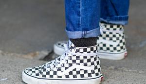 A person wears checkerboard Vans.Edward Berthelot/Getty Images