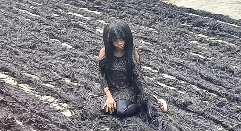 Nigerian lady sets new Guinness World Record for longest handmade wig [TheStar]