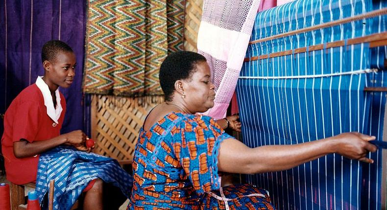 An Akwete weaver with her apprentice