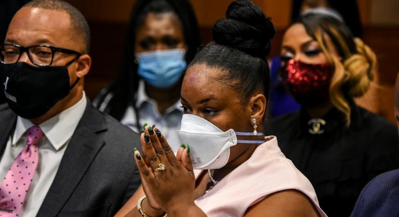 The widow of Rayshard Brooks, Tomika Miller, listens in an Atlanta courtroom as Fulton County District Attorney Paul Howard announces charges against the policeman who killed her husband.